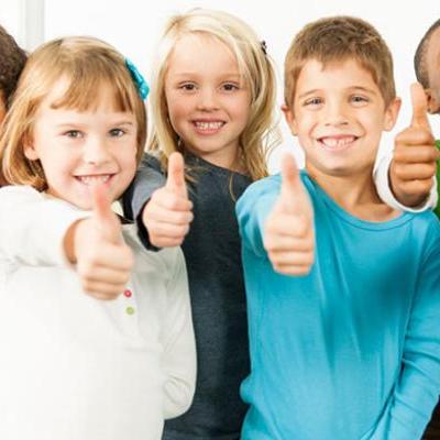 kids showing thumbs up