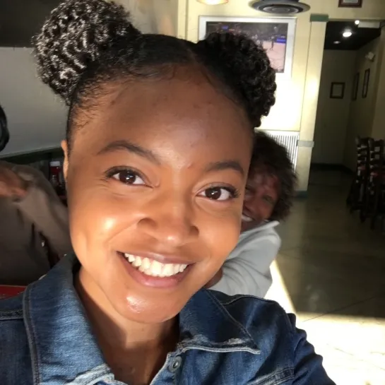 Woman taking a selfie and smiling at the camera