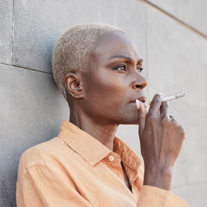 Mature-african-woman-smoking-a-cigarette