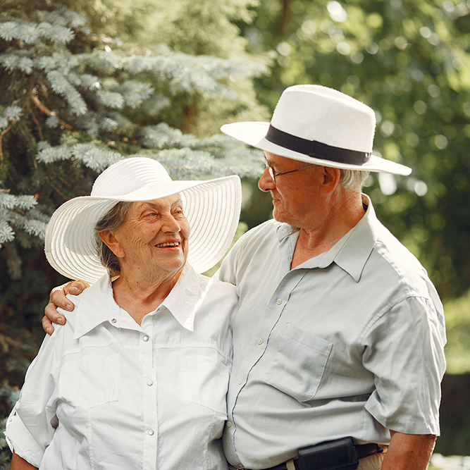 Happy old couple in a summer garden