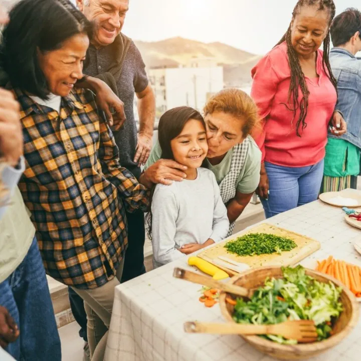 Family cooking food outside