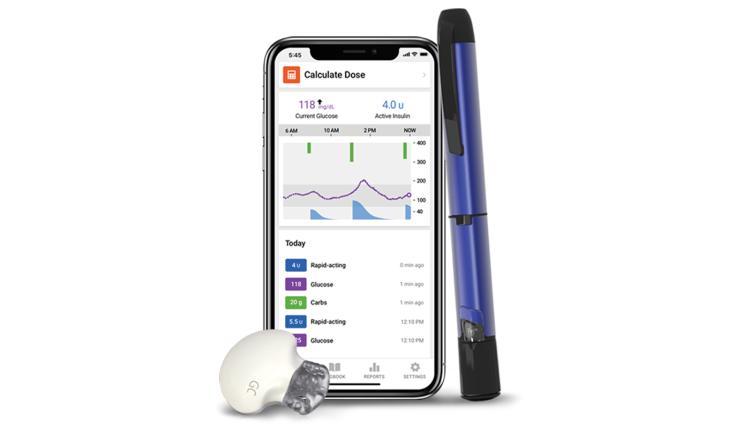 medtronic smart insulin pen and wireless transmitter next to smartphone