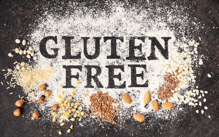 Gluten-free written in flour on baking sheet for kidney-friendly meals