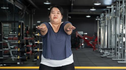Asian woman exercising in gym