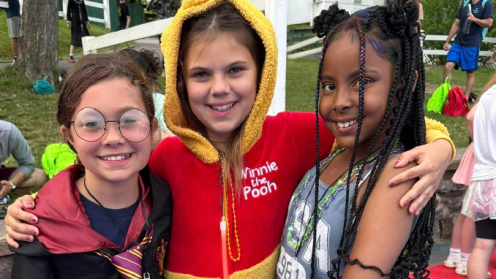 Three smiling young girls at diabetes camp
