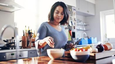 Woman prepping food in kitchen