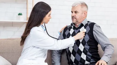 Doctor examining patient with stethoscop