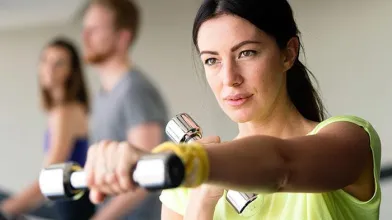 Woman exercising with dumbbells