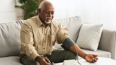 Senior man checking blood pressure