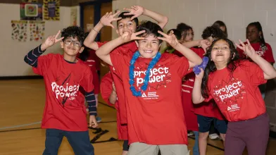 A group of kids in the Project Power youth program playing and having fun