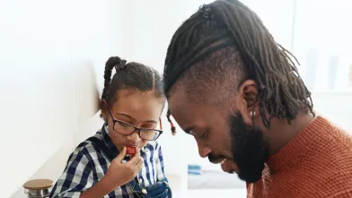 Father and daughter prepping healthy food