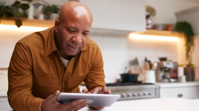 Man looking at tablet