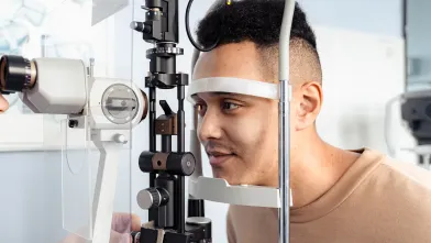A man gets his eyes examined for diabetes eye disease