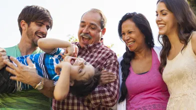 Smiling family outside