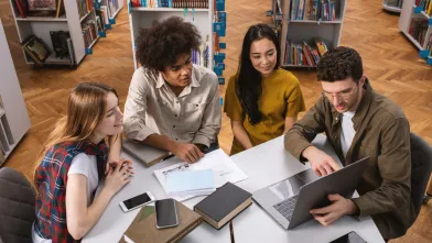 Group of students working together in the library