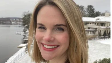 Portrait of a woman outside in snowy weather.