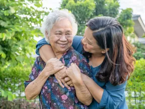 Asian-elderly-woman-with-caregiver-walking
