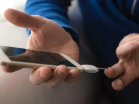 Person checking blood glucose with meter