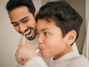 face-of-dad-boy-and-child-brushing-teeth-for-hygiene