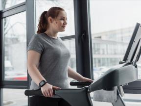 Heavy set woman on treadmill