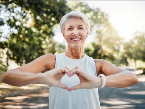 Woman making heart sign