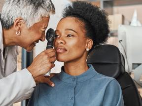 African American woman getting eye exam