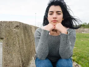 Teenage Latina girl looking sad