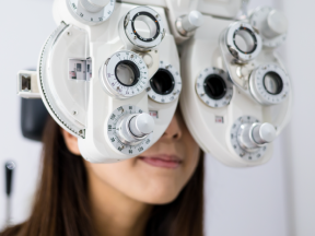 Woman at optometrist office getting eyes checked