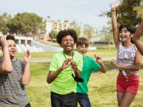 A group of kids outside laughing