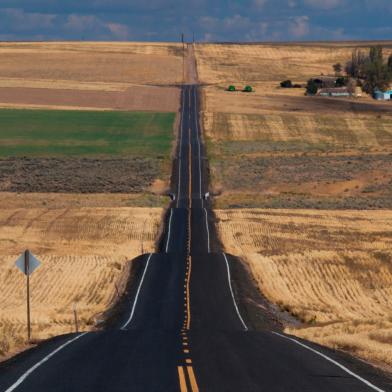 Long two-lane road through countryside