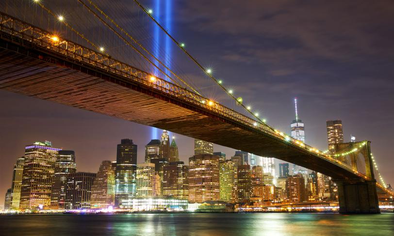New York city skyline at night with brooklyn bridge