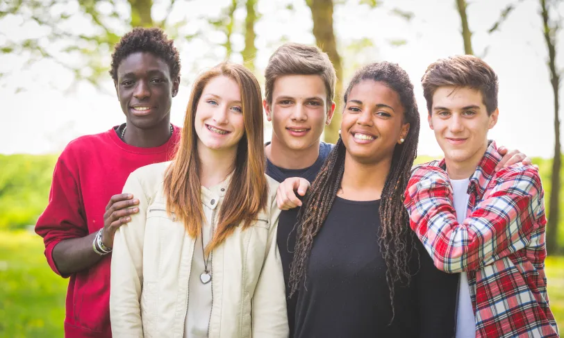 Multiracial group of smiling teenagers