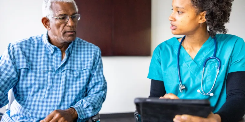 Individual speaks with medical professional 