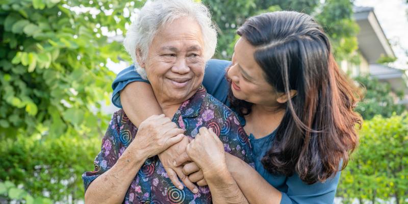 Asian-elderly-woman-with-caregiver-walking