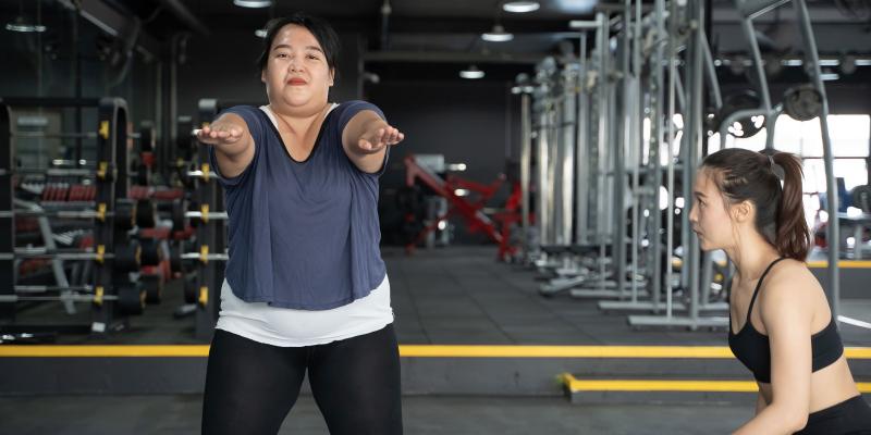 Asian woman exercising in gym