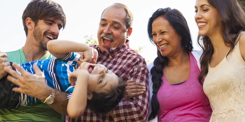 Smiling family outside