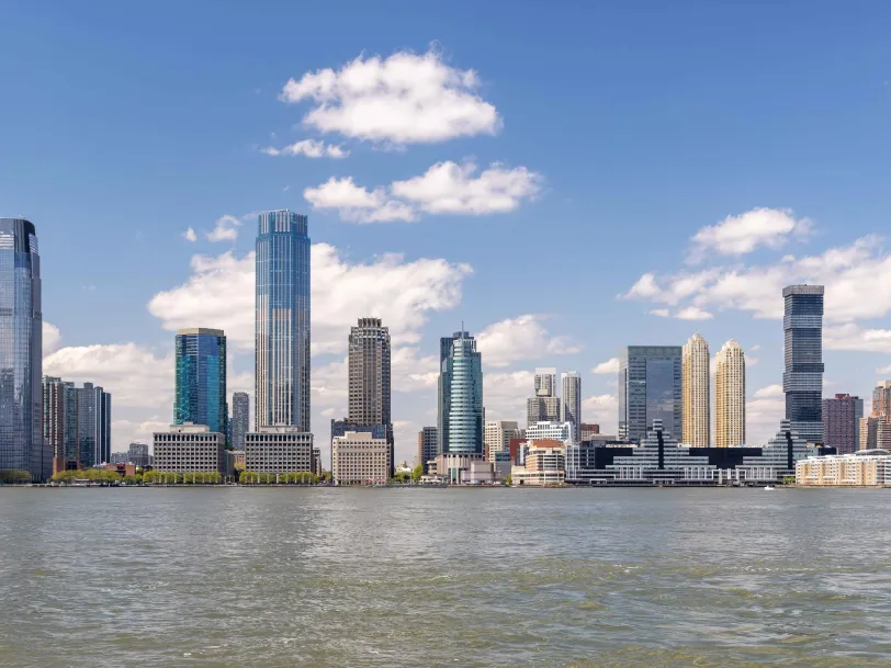 Jersey city new jersey skyline against water