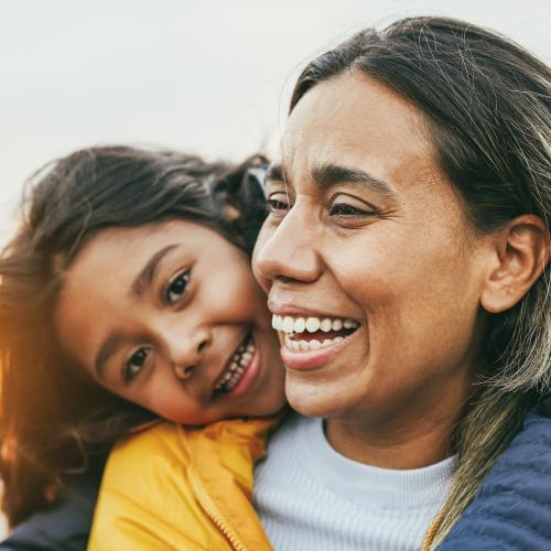 Happy Latin mother and daughter