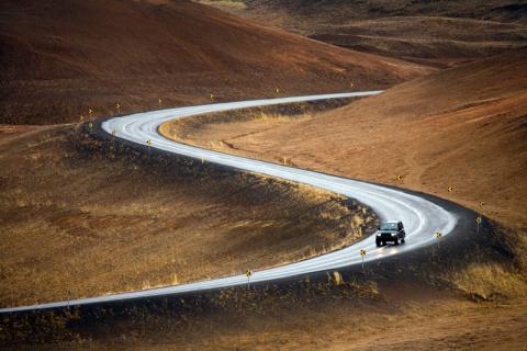 A car driving on a curvy road