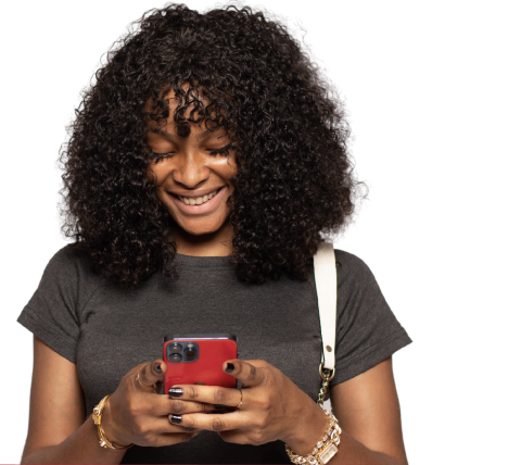 Smiling African american woman looking at her phone