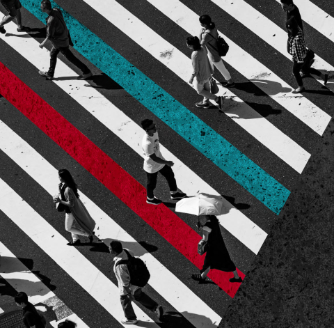 Overhead picture of people walking across a road