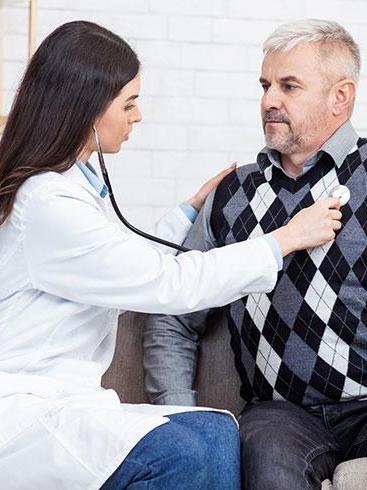Doctor examining patient with stethoscop