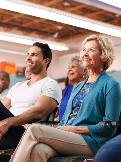 People sitting at town hall meeting