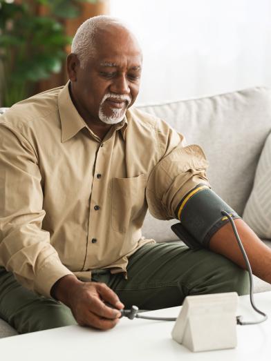 Senior man checking blood pressure