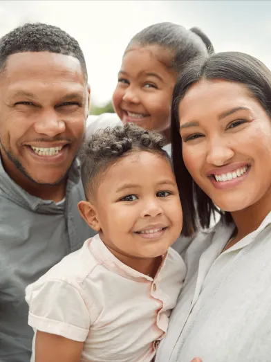 Smiling African American husband, wife, and children