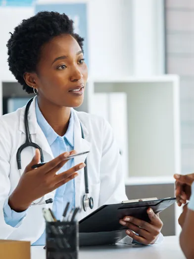 Female physician talking to patient