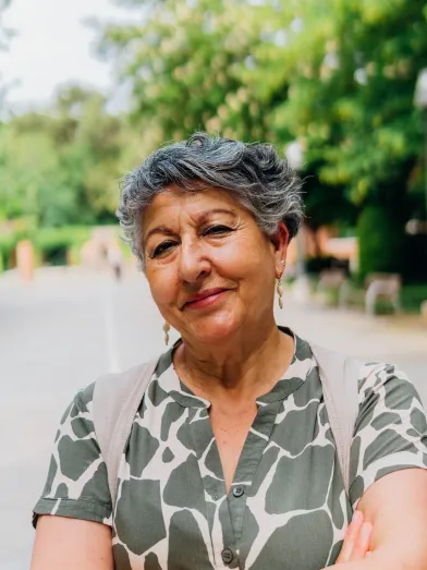 Senior Latina woman with arms folded