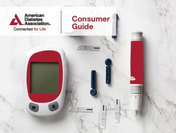 Red glucose meter and blood sugar testing supplies on marble counter top