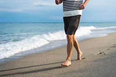 Guy running on beach
