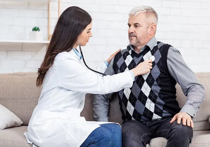 Doctor examining patient with stethoscop